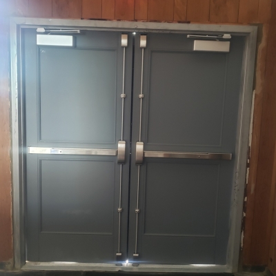 Southern Baptist Church -  Pair of two panel doors with stainless steel vertical panic exit devices.